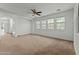 Spacious living room with neutral carpeting and ample natural light at 21150 W Prospector Way, Buckeye, AZ 85396