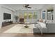 Spacious living room featuring a comfortable sectional sofa and large windows at 21150 W Prospector Way, Buckeye, AZ 85396