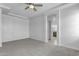 Primary bedroom with ceiling fan and en-suite bathroom access at 24235 N 194Th Ave, Surprise, AZ 85387