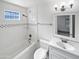 Clean bathroom with white subway tile and a bathtub at 309 E Weldon Ave, Phoenix, AZ 85012