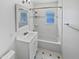 Clean bathroom with white subway tiles and a shower/tub combo at 309 E Weldon Ave, Phoenix, AZ 85012