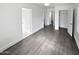 Spacious bedroom with grey tile floors and access to bathroom and closet at 309 E Weldon Ave, Phoenix, AZ 85012