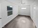 Bright bedroom with grey tile floors and large window at 309 E Weldon Ave, Phoenix, AZ 85012
