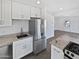 Updated kitchen with stainless steel appliances and granite counters at 309 E Weldon Ave, Phoenix, AZ 85012