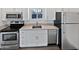 Modern kitchen features stainless steel appliances and granite countertops at 309 E Weldon Ave, Phoenix, AZ 85012