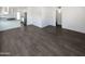 Open concept living room with modern kitchen and tile floors at 309 E Weldon Ave, Phoenix, AZ 85012