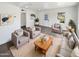 Bright and airy living room with wood coffee table at 309 E Weldon Ave, Phoenix, AZ 85012