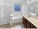 Bathroom features double vanity, soaking tub, and shower at 3305 S 122Nd Ln, Tolleson, AZ 85353