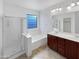 Bathroom features double sinks, a soaking tub, and a walk-in shower at 3305 S 122Nd Ln, Tolleson, AZ 85353