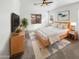 Bright bedroom with a large bed, dresser, and flat-screen TV at 3305 S 122Nd Ln, Tolleson, AZ 85353