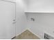 Bright laundry room with built-in shelving and exterior access at 3305 S 122Nd Ln, Tolleson, AZ 85353
