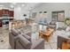 Open concept living area with kitchen, dining, and seating areas at 3305 S 122Nd Ln, Tolleson, AZ 85353