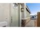 Inviting front door of a home with stone accents and an exterior light fixture at 4380 N 203Rd Dr, Buckeye, AZ 85396