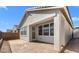 Exterior view of backyard featuring covered patio and block wall at 4419 N 203Rd Ave, Buckeye, AZ 85396