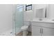This bathroom features a glass shower stall, toilet, and vanity with sink at 4419 N 203Rd Ave, Buckeye, AZ 85396