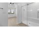 This bright, modern bathroom features a glass shower with a bench at 4419 N 203Rd Ave, Buckeye, AZ 85396