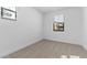 This bedroom offers neutral carpet and walls, and bright windows for natural light at 4419 N 203Rd Ave, Buckeye, AZ 85396