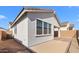Rear exterior featuring covered patio, stucco and low maintenance yard at 4419 N 203Rd Ave, Buckeye, AZ 85396