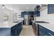 Well-lit kitchen with stainless steel appliances and lots of storage at 4419 N 203Rd Ave, Buckeye, AZ 85396