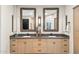 Modern bathroom boasting double sinks, sleek countertops, and large mirrors at 5250 E Deer Valley Dr # 450, Phoenix, AZ 85054
