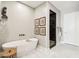 Spa-like bathroom featuring a soaking tub, walk-in shower, and neutral colors at 5250 E Deer Valley Dr # 450, Phoenix, AZ 85054