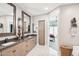 Luxurious bathroom with double vanity, view to bedroom, and a walk-in shower at 5250 E Deer Valley Dr # 450, Phoenix, AZ 85054