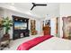 Bedroom with king bed, large TV, and ample storage at 5250 E Deer Valley Dr # 450, Phoenix, AZ 85054
