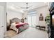 Spacious bedroom with king-size bed, ceiling fan, and access to balcony at 5250 E Deer Valley Dr # 450, Phoenix, AZ 85054