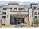 The Luxe 5250 building entrance, featuring a modern design with stone accents and water feature at 5250 E Deer Valley Dr # 450, Phoenix, AZ 85054