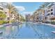 Resort-style pool with lounge chairs and surrounding landscaping at 5250 E Deer Valley Dr # 450, Phoenix, AZ 85054