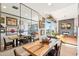 Bright dining area with rustic wood table and mirrored wall at 5250 E Deer Valley Dr # 450, Phoenix, AZ 85054