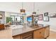 Modern kitchen with large island and view to living room at 5250 E Deer Valley Dr # 450, Phoenix, AZ 85054