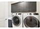 Laundry room with washer, dryer, and ample cabinetry at 5250 E Deer Valley Dr # 450, Phoenix, AZ 85054
