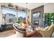 Living room with large windows, fireplace, and comfortable seating at 5250 E Deer Valley Dr # 450, Phoenix, AZ 85054