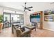 Living room with wood floors, fireplace, and access to balcony at 5250 E Deer Valley Dr # 450, Phoenix, AZ 85054