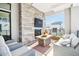 Relaxing patio with fireplace, seating area, and city views at 5250 E Deer Valley Dr # 450, Phoenix, AZ 85054