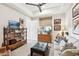 Cozy sitting area featuring a sofa, ottoman, and built-in shelving at 5250 E Deer Valley Dr # 450, Phoenix, AZ 85054