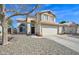 Charming two-story home boasting desert landscaping, a two-car garage, and great curb appeal at 659 S Dodge St, Gilbert, AZ 85233