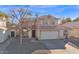 Charming two-story home features a well-maintained front yard, mature trees, and a welcoming entrance at 659 S Dodge St, Gilbert, AZ 85233