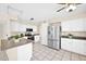 Bright kitchen featuring white cabinets, stainless steel appliances, and tiled flooring at 659 S Dodge St, Gilbert, AZ 85233