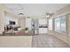 Bright kitchen featuring white cabinets, stainless steel appliances, and tiled flooring at 659 S Dodge St, Gilbert, AZ 85233