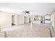Open floor plan boasts tile flooring and seamlessly connects the living area with the kitchen at 659 S Dodge St, Gilbert, AZ 85233