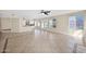 Open-concept living room flows into the kitchen and has lots of natural light and tile flooring at 659 S Dodge St, Gilbert, AZ 85233