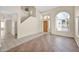 Spacious living room with stairs, neutral color walls, and tiled flooring at 659 S Dodge St, Gilbert, AZ 85233