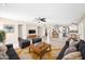 Open concept living space with tile flooring, an adjacent kitchen and dining area, and plenty of room to relax at 659 S Dodge St, Gilbert, AZ 85233