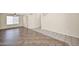 Large living room with tiled flooring, ceiling fan and bright windows at 659 S Dodge St, Gilbert, AZ 85233