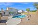 Inviting backyard pool with rock accents and a charming pergola, perfect for outdoor relaxation and entertainment at 659 S Dodge St, Gilbert, AZ 85233