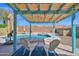 Relaxing backyard pool featuring an umbrella, shade, and two chairs for maximum fun at 659 S Dodge St, Gilbert, AZ 85233