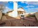 Landscaped backyard with a patio, fire pit, and storage shed at 8749 E Willetta St, Scottsdale, AZ 85257