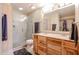 Bathroom with double sinks, a large shower, and a linen closet at 8749 E Willetta St, Scottsdale, AZ 85257